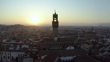 Aerial video of Palazzo Vecchio at the sunset. Aerial view of Palazzo Vecchio. Flying close to Palazzo Vecchio. Florence, Tuscany, Italy.
