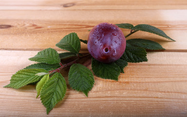 Wall Mural - Red plums on table