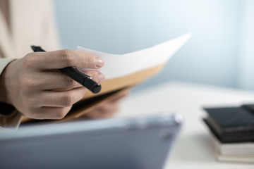 Business woman in suite working with  documentary data on white desk at office, Business accounting and financial concept