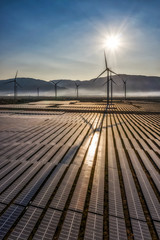 Wall Mural - Aerial view of windmill and Solar panel, photovoltaic, alternative electricity source - concept of sustainable resources on a sunny day, Bac Phong, Thuan Bac, Ninh Thuan, Vietnam