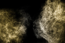 Explosion Of Gold Powder On Black Background
