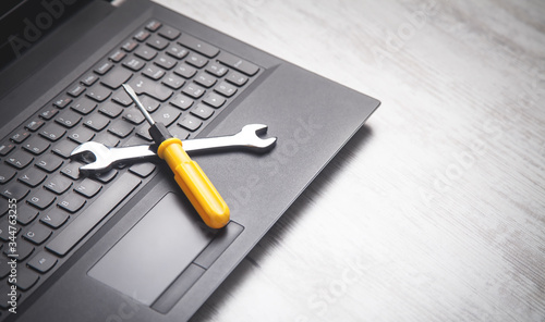 Fotomural Wrench and screwdriver on the computer keyboard