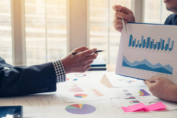 Teamwork of business people Financial data graph analysis On the table in the meeting room.