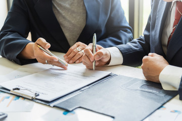 Wall Mural - Businessman sign the contract, the agreement in the document.