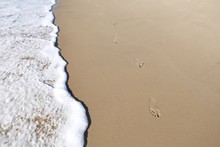 High Angle View Of Footprints On Beach