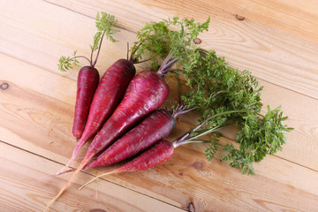 Red carrots on table