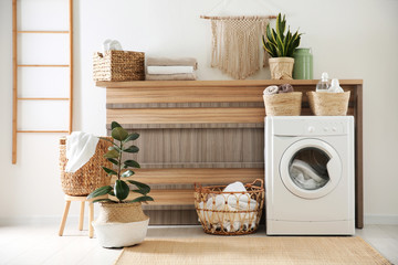 Poster - Modern washing machine and plants in laundry room interior