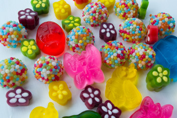 Wall Mural - Multi-colored sweets, marmalade and sweets isolated on a white background.