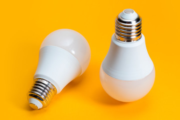 LED, New technology light bulb on yellow background, Energy super saving electric lamp is good for environment