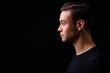 © Ranta Images - Young handsome multi ethnic man against black background