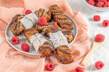 Wall Mural - Cereal bars with raspberries on kitchen counter top.