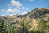 Fototapeta Góry - The Washington Section of the Pacific Crest Trail in the North Cascades with view of cloud covered rocky mountains.