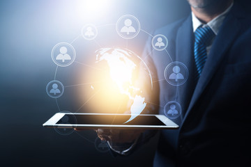 global network connection and high technology, businessman holding tablet with glob earth with line connect, worldwide, networking internet concept,Element of this earth furnished by Nasa