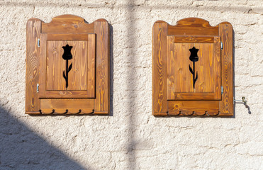 Wood shutters on a traditional village house in Noszvaj, Hungary