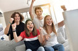 © goodluz - Young people supporting France national team on tv