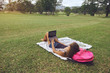 © Ekaterina - Young woman using laptop computer on a park. Freelance work concept