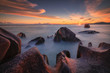 © Erika Valkovicova - Beautiful colourful sunset on the beach with granite rocks in Seychelles.