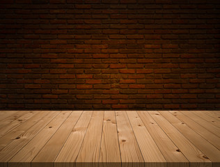 Empty perspective brown plank wooden board as mock up display shelf or tabletop with abstract beautiful old dark brown brick blocks wall in coffee shop and warming light from electric lamp background.