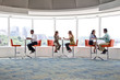 © Jon Feingersh - Business people working in office cafeteria