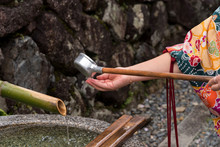 Washing Hands Before Entering A Temple In Japan