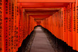 © Bisual Studio/Stocksy - Walkway under orange wooden pillars, Kyoto, Japan