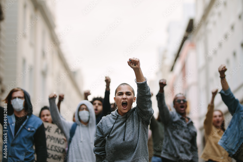 Group of demonstrators protesting in the city Stock Photo | Adobe Stock