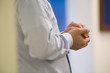 © Bill Gallery - Close up of hands of conversation participant listening and waiting.