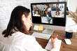 © Kateryna - Online training. The back view of a girl who learns online by video conference online. On the screen, the teacher tells the information to her and other participants in the conference