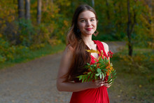 Girl In Red Dress In The Woods