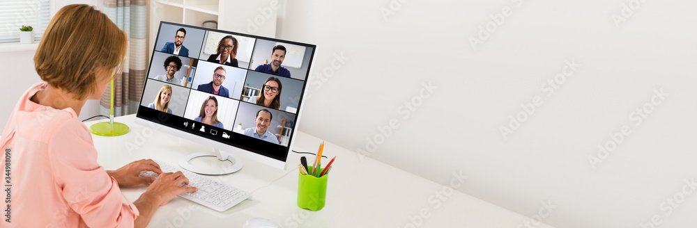 Woman Videoconferencing On Computer - obrazy, fototapety, plakaty 