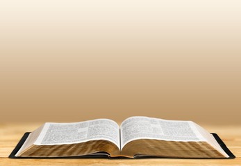 Wall Mural - open book on old wooden table.