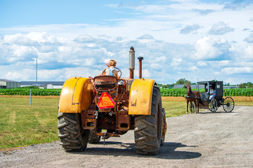 Wall Mural - Small Boy Drives Tractor and Amish Buggy