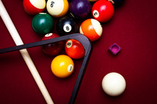 Billiard Balls On A Red Felt Pool Table