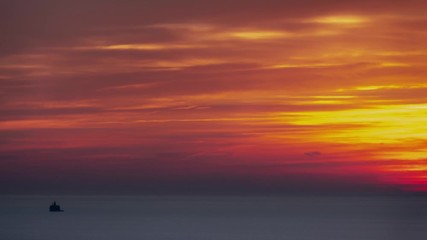 Wall Mural - aerial timelapse of an incredible beautiful layered feathery pink, orange, blue and yellow sky sunri
