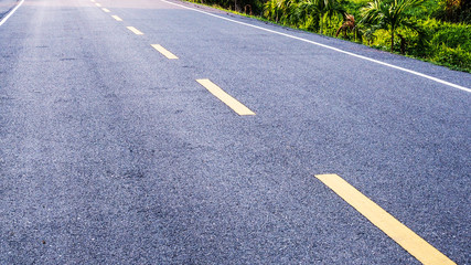 Yellow line on asphalt road in Asia.