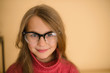 © cheese78 - girl of school age with glasses in red sweater