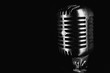 © Michal Šteflovič - Retro silver microphone on black background