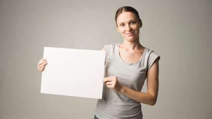 Person holding white empty paper