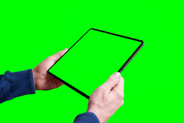 Poster - Tablet mockup in man hands isolated in chroma key green