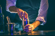 Bartender using cocktail shaker