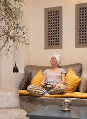 Woman relaxing after spa treatment in a Moroccan riad