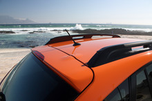 Orange Car At The Beach