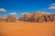 © Артём Князь - gorgeous Wadi Rum panoramic landscape beautiful famous travel destination site of Jordan desert aerial photography with sand valley foreground and rocky mountains horizon background in summer day
