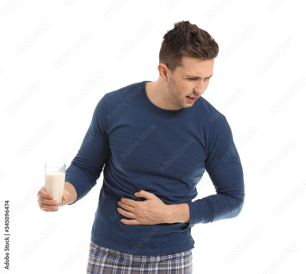 Young man with milk allergy on white background