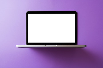 Wall Mural - Laptop with blank screen mockup concept. Creative workspace background.