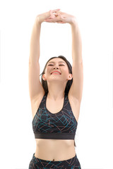 Beautiful Asian women are warming up before doing exercise and yoga. Photo of asian girl by isolated white background. Fitness and healthy lifestyle concept.