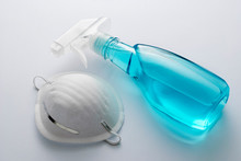 Spray Bottle Of Sanitizer With Face Mask