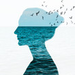 Woman portrait with double exposure and with the blue sea and flying birds