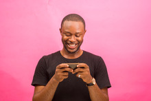 Young Handsome African Man Feeling Excited About What He Saw On His Phone