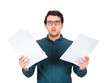 © 1STunningART - Perplexed businessman looking stunned to camera as holds different paper documents in both hands isolated on white background. Puzzled business person has workplace troubles, negative financial report